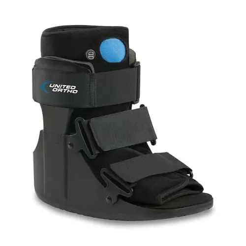 United Ortho Short Air Cam Walker Fracture Boot in black, showing sturdy plastic uprights and adjustable straps.