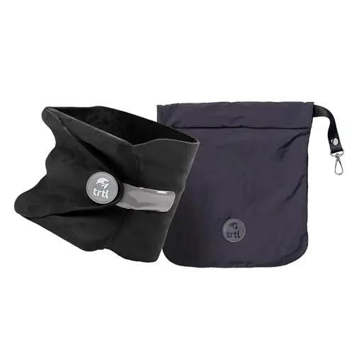 TRTL travel pillow in black, showing its fleece wrap and internal support system.