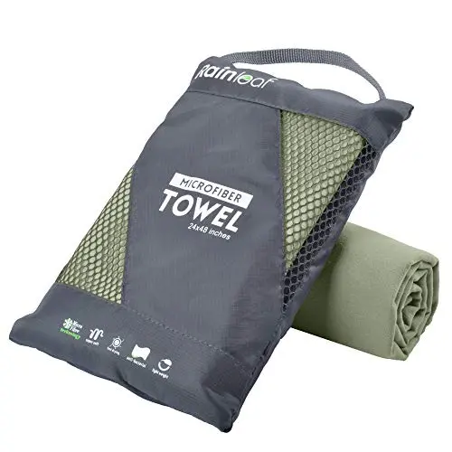 Rainleaf microfiber travel towel in apple green, showing snap loop and compact size