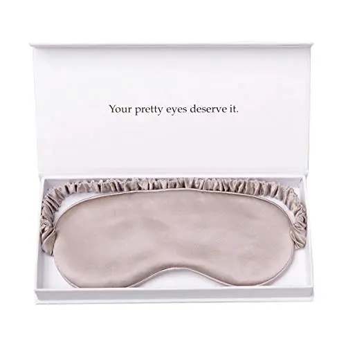 YANSER caramel-colored mulberry silk sleep mask on a bed