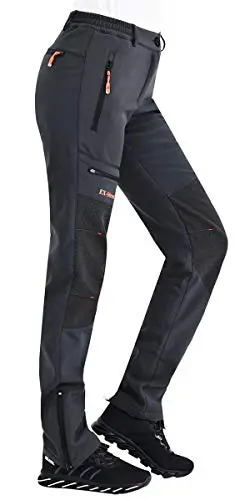 Postropaky Women's Waterproof Softshell Hiking Pants with multiple zipper pockets.