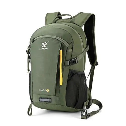 SKYSPER small black hiking backpack with yellow accents on a mountain trail