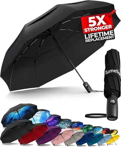 TUMELLA vented double canopy travel umbrella open in the rain
