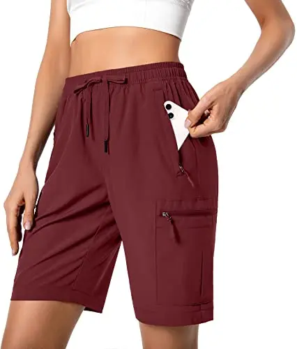Women's maroon hiking cargo shorts with five zipper pockets and a drawstring waist.