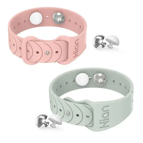 Hion motion sickness bracelet with multiple white and metal acupressure beads in beryl and pink