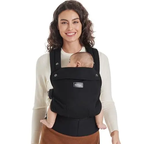 Momcozy ergonomic baby carrier in black, showcasing its cross-back strap design and padded waist support.