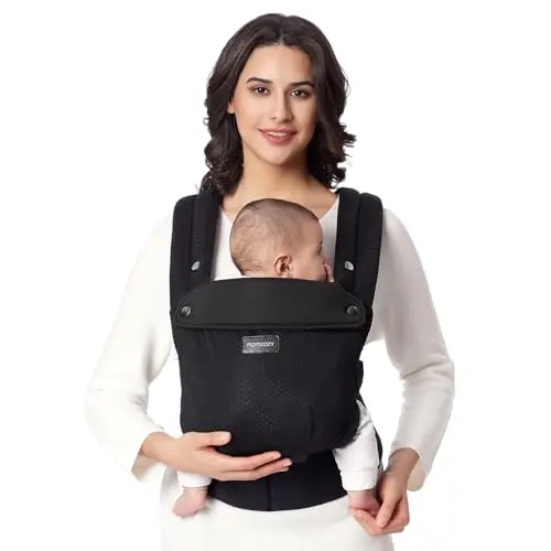 Momcozy black baby carrier with large air mesh panels and an X-shaped back design.