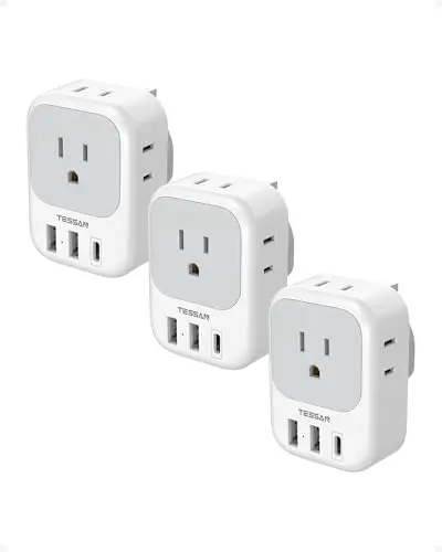 Three-pack of TESSAN Type G travel adapters, each with 4 outlets and 3 USB ports