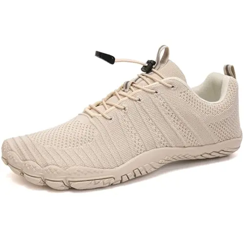 WateLves beige water shoes with five-toes design on a rocky beach