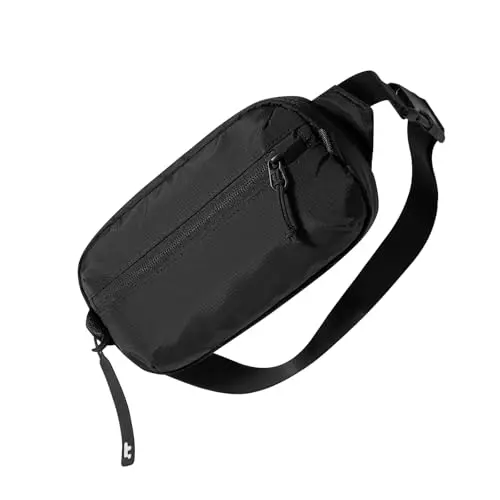 Compact black tomtoc sling bag, highlighting its minimalist design and YKK zippers.