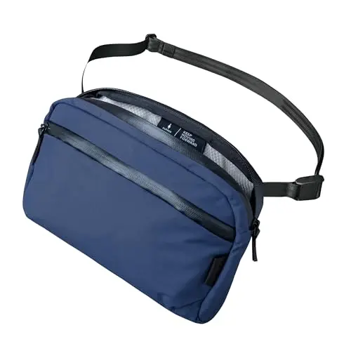 ALPAKA Flight Sling 2L in blue Axoflux fabric, showing a compact, rectangular shape