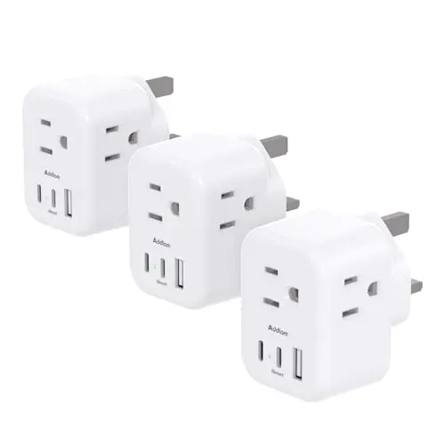 Three-pack of Addtam Type G travel adapters with 3 outlets and 3 USB ports each