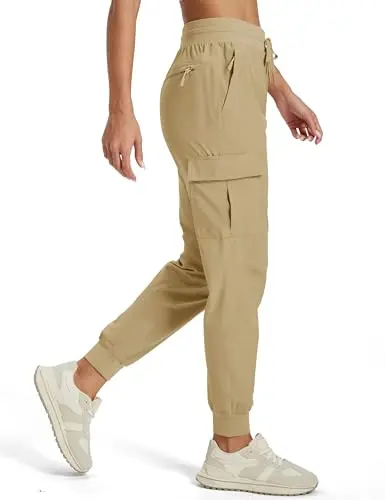 Women's tapered jogger-style cargo pants with a stretchy ankle cuff, ideal for active travel.
