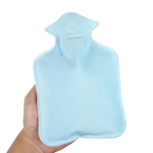Small blue hot water bottle with a soft fuzzy cover